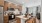 Kitchen with large island, custom cabinetry, and stainless steel appliances